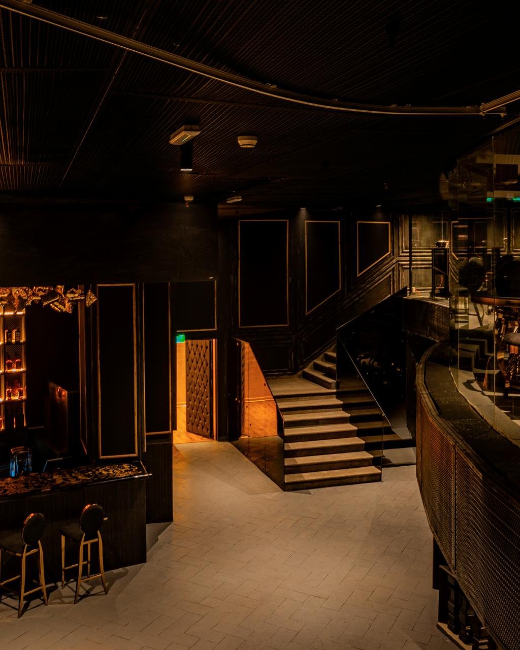 Inside Club 11, Grand Hyatt Muscat — the dance floor and staircase